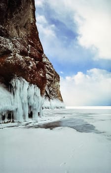 Winter on the Baikal, ice and snow on the lake. The beauty of the nature of Baikal in winter.