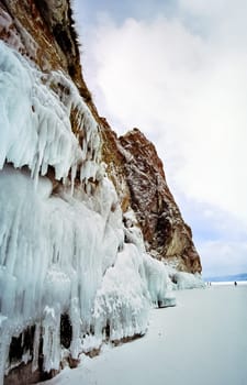 Winter on the Baikal, ice and snow on the lake. The beauty of the nature of Baikal in winter.