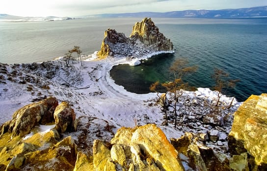 Winter on the Baikal, ice and snow on the lake. The beauty of the nature of Baikal in winter.