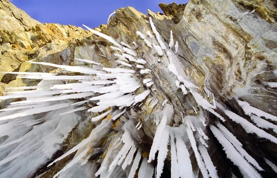 Winter on the Baikal, ice and snow on the lake. The beauty of the nature of Baikal in winter.