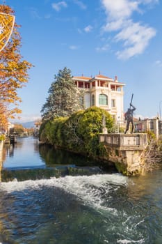 L'Isle-sur-la-Sorgue, France - November 27 2023: L'Isle-sur-la-Sorgue, a town famous for antiques in Provence, vertical photo, France