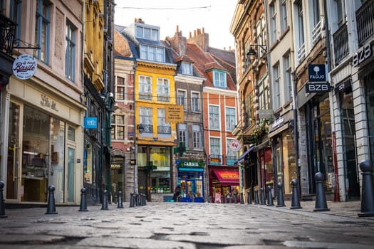 Lille, France - August 08 2022: Street and shops in the old city of Lille seen from the ground