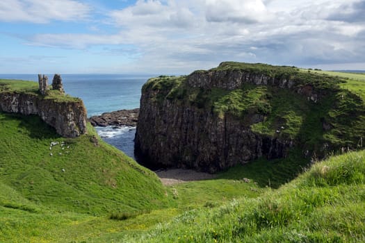 Dunseverick Castle in County Antrim, Northern Ireland. Located near the small village of Dunseverick and the Giant's Causeway. Dunseverick Castle and earthworks are Scheduled Historic Monuments in the Moyle District Council area. Dunseverick Castle and the peninsula on which it stands were given to the National Trust in 1962 by local farmer Jack McCurdy.