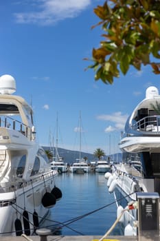 Montenegro, Porto Montenegro, Tivat, 03.July 2024. view from the promenade of yachts and boats in the port on a sunny day, Adriatic