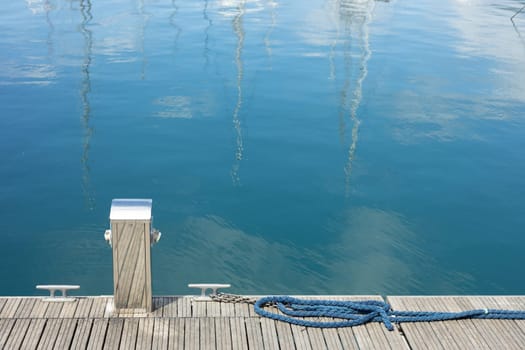 Electrical sockets for charging boats in the harbor on the pier by the sea coast. Charging a yacht from a power station in the marina.
