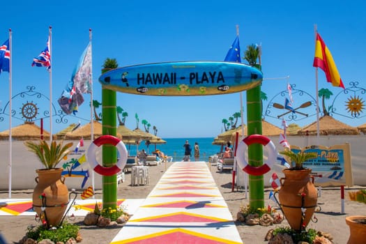 TORREMOLINOS, SPAIN, Andalusia 21 May 2019. Flags at the entrance to Playa Hawai beach in Torremolinos, Malaga province.