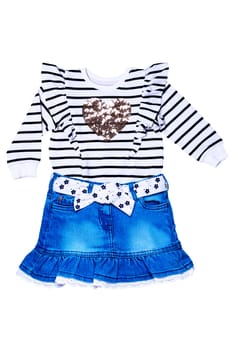 A black and white striped sweater or pullover with a heart and a cute short blue denim skirt with a white fabric belt with flowers and bow isolated.