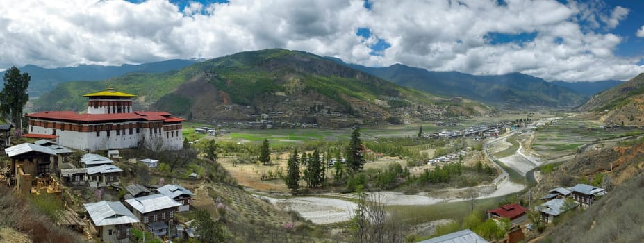 Panoramic view of Paro Dzong Buddhist monastery and Paro Valley in the Kingdom of Bhutan.