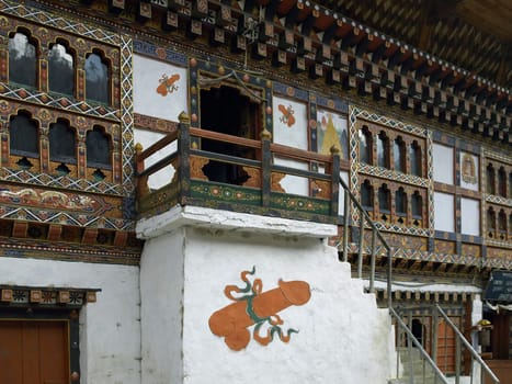Fertility symbols on the exterior of a row of Bhutanese houses - Kingdom of Bhutan.