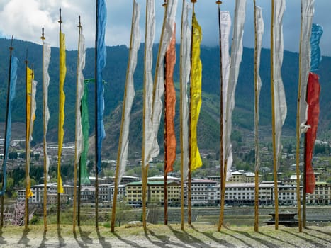 Buddhist prayer flags on a hillside above the capital city of Thimpu in the Kingdom of Bhutan.