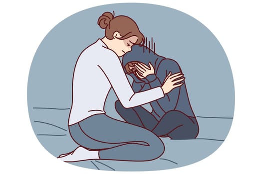 Mother consoles crying daughter who is depressed due to peer problems or poor school performance. Caring woman hugging and consoles crying girl after argument or house arrest related to bad behavior
