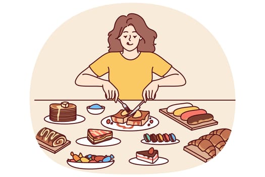 Woman overeats desserts sitting at table with sweet high-calorie food tasting cakes and croissants, forgetting about diet. Girl eats desserts during cheat meal without fear of gaining weight