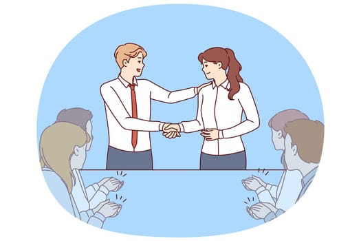 Handshake of boss and new employee of company during business meeting with colleagues. Man boss shakes hands with employee who has successfully completed complex project or attracted most customers