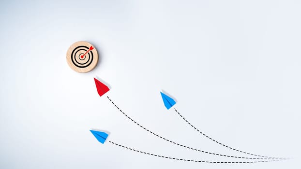 Red airplane flying towards target on white background, The concept of leadership, Achieving the goal, Success, Risk management, Business creativity new idea discovery innovation technology.