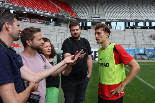 The new signings,such as Patrick Osterhage (SC Freiburg) here,were sought-after interview partners at the start of training for Bundesliga football club SC Freiburg 2024  DFL REGULATIONS PROHIBIT ANY USE OF PHOTOGRAPHS AS IMAGE SEQUENCES AND/OR QUASI-VIDEONann  Photo: Joachim Hahne/johapress