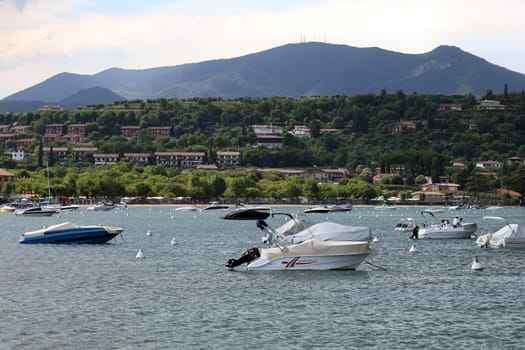 Boats in the small bay in front of Manerba del Garada on Lake Garda  Travel Photography - Lake Garda / Lago di Garda / Italy /Italy / Italia