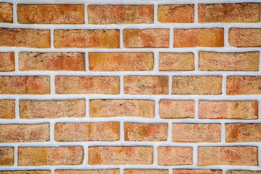 A weathered red brick wall with visible grout lines arranged horizontally, background image