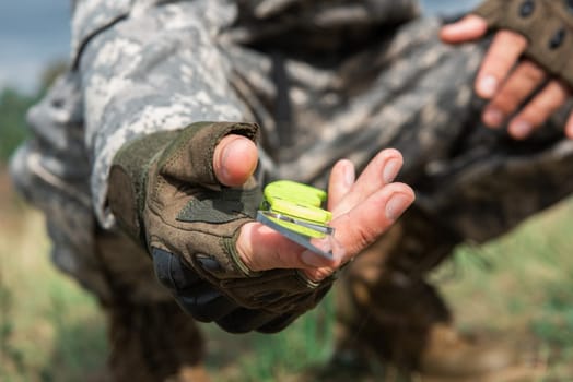 A man with a knife in the forest. Travel or military concept