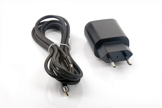 Power Adapter with USB C Cable isolated over bright background