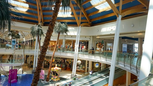 Rimini, Italy - June 25, 2024: Le Befane Centre of Commerce. This is the biggest shopping center in Rimini. Unidentified people are shopping.