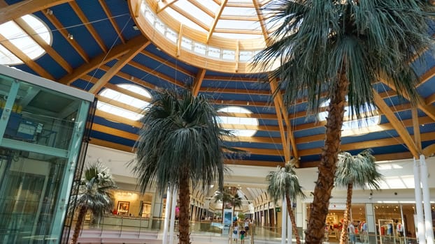 Rimini, Italy - June 25, 2024: Le Befane Centre of Commerce. This is the biggest shopping center in Rimini. Unidentified people are shopping.