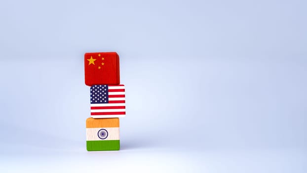 Screen printed USA flag and China flag on wooden cube, showing trade competition and tariff barriers, trade war between USA and China, global trade competition.