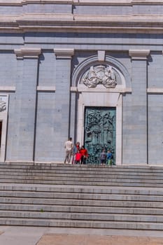 Madrid, Spain: April 24, 2024: People at the entrance of the Almudena Cathedral, Santa Maria la Real de La Almudena.