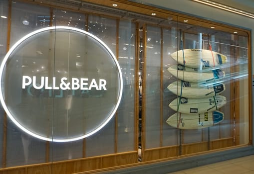 Rimini, Italy - June 25, 2024: Le Befane Centre of Commerce- PULL and BEAR retail clothing boutique in shopping mall. Pull Bear is a Spanish clothing and accessories retailer.