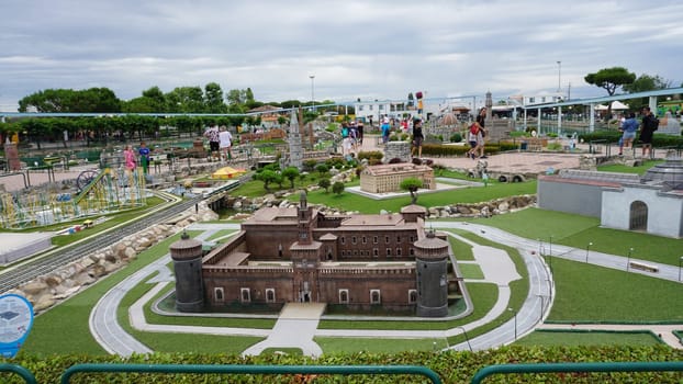 Viserba, Italy - June 25, 2024: People going at Theme park Italy in Miniature or Italia in Miniatura in Rimini, Italy - Reproduction of famous attractions in a small scale - Milan