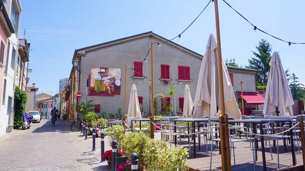 Rimini, Italy - June 25, 2024: Mural on wall at Borgo San Giuliano typical street with low and colorful houses at Rimini, Italy