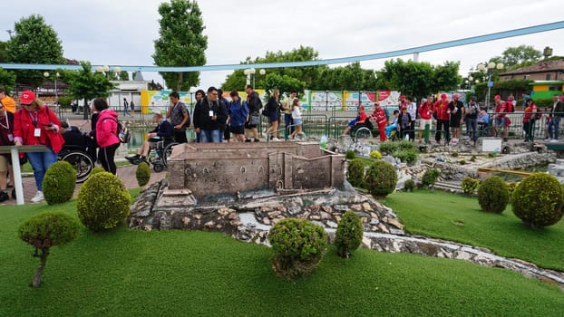 Viserba, Italy - June 25, 2024: People going at Theme park Italy in Miniature or Italia in Miniatura in Rimini, Italy - Reproduction of famous attractions in a small scale