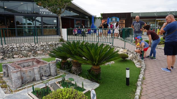Viserba, Italy - June 25, 2024: People going at Theme park Italy in Miniature or Italia in Miniatura in Rimini, Italy - Reproduction of famous attractions in a small scale