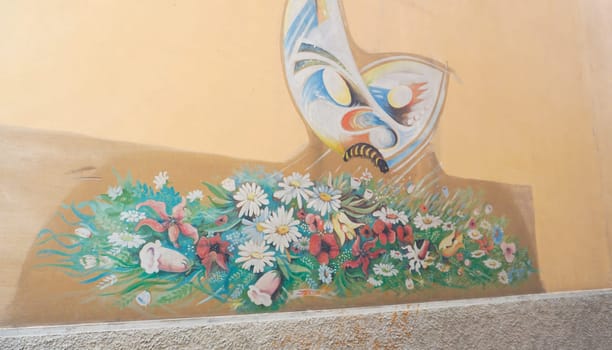 Rimini, Italy - June 25, 2024: Mural on wall at Borgo San Giuliano typical street with low and colorful houses at Rimini, Italy
