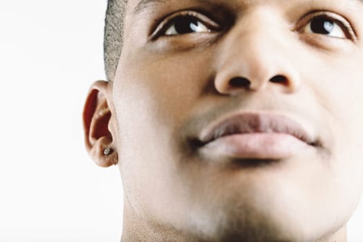 ear-ring on a closeup portrait of a young black man's ear