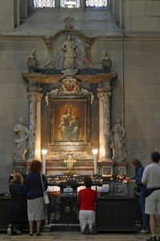 Women pray at the altar of Virgin Mary in Zagreb Cathedral, Zagreb, Croatia