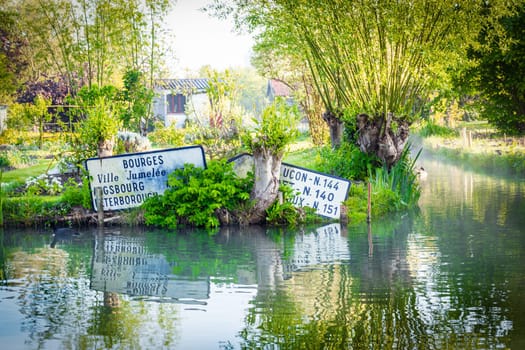 Signs in the water, marshland in Bourges, France