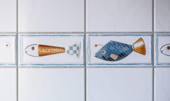 GERMANY, QUEDLINGBURG - September 06 -2023: Tiles with beautiful fish motifs on the wall