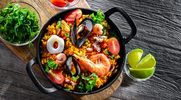 Seafood paella served in a cast iron pan.