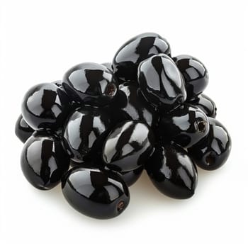 A pile of glossy black olives sits on a white background