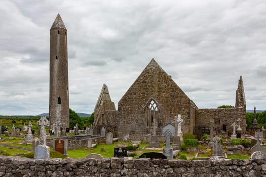 The ruins of Kilmacduagh Monastery near the town of Gort in County Galway, Republic of Ireland. The abbey was founded by Saint Colman, son of Duagh in the early 7th century.