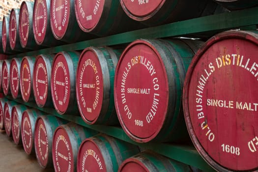 Wooden whiskey barrels at the Bushmills Distillery in County Antrim, Northern Ireland.