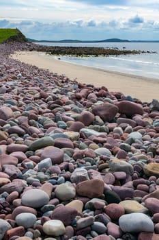 Pebbles on a beach near seaside village of Mulranny on the isthmus between Clew Bay and Blacksod Bay in County Mayo, Republic of Ireland.