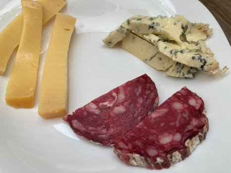 Sliced ​​meat and cheese in a the plate