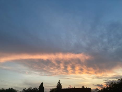 Clouds at sunset on a the hot summer day