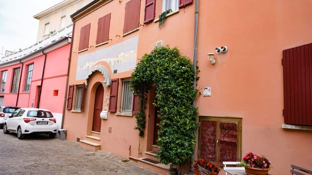 Rimini, Italy - June 25, 2024: Mural on wall at Borgo San Giuliano typical street with low and colorful houses at Rimini, Italy