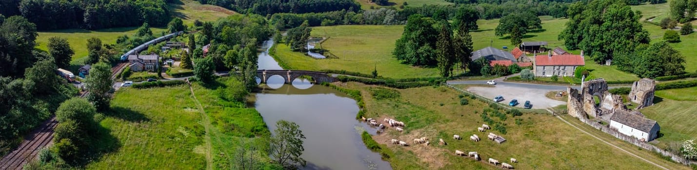Panoramic aerial view of the village of Kirkham and the ruins of Kirkham Priory in the Ryedale District of North Yorkshire in northeast England. The ruins of Kirkham Priory are situated on the banks of the River Derwent and dates from 1120AD.