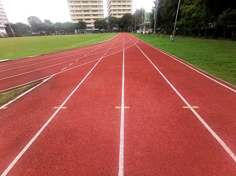 The running track inside a football stadium is usually a circular pathway surrounding the field
