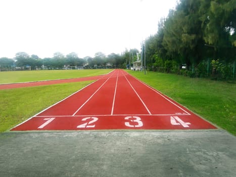 The running track inside a football stadium is usually a circular pathway surrounding the field