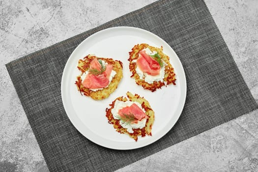 Top view of potato flapjack with salmon and cream cheese