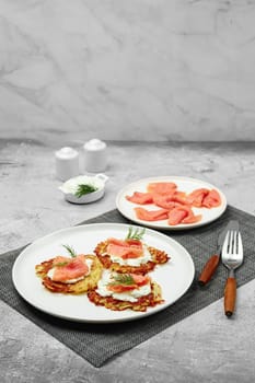 Fried potato pancake with salmon and cream cheese